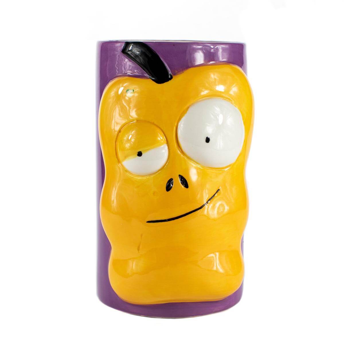 The Ceramic Monster Face Candle – Yellow resembles a cartoonish yellow apple with big eyes and a crooked mouth, similar to a whimsical ceramic mug, shown against a purple background.