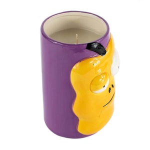 Add Halloween charm to your space with the Ceramic Monster Face Candle – Yellow, a ceramic holder featuring a yellow cartoon design and a white soy wax candle with visible wick.