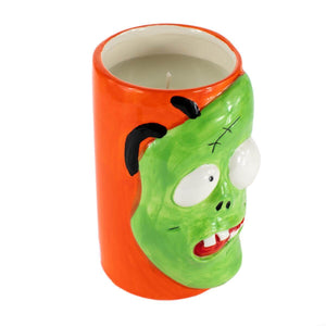 The Ceramic Monster Face Candle – Green features a quirky green monster face with bulging eyes and black stitches, filled with soy wax. Perfect for Halloween décor, this unique candle adds spooky charm to any space.