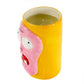 The Ceramic Monster Face Candle – Pink features a cartoonish ceramic holder with bulging eyes, a pink mouth, and a yellow exterior. This soy wax candle adds quirky charm as a unique Halloween décor piece.