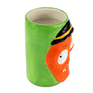 The Ceramic Monster Face Candle – Orange is a green ceramic mug with an orange cartoon monster face, large eyes, and a black-and-yellow headband—perfect for quirky Halloween decor.