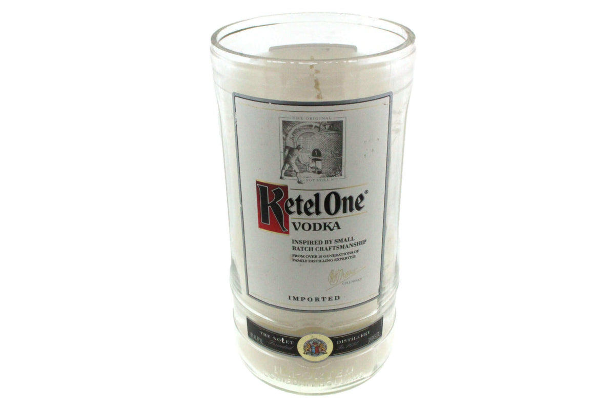 The Recycled Imported Vodka Candle is a natural soy candle in a repurposed Ketel One bottle, featuring the original label—a unique, eco-friendly accent for any space.