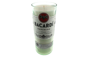 The Recycled White Rum Candle is a natural soy candle in a glass container crafted from a recycled white rum bottle, featuring the original Bacardi Superior label.