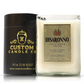 The Recycled Italian Liqueur Bottle Candle—a natural soy candle in a glass holder labeled "Disaronno Originale"—makes a unique addition to your personalized Custom Candle collection from Custom Candle Co.