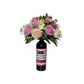 Wine and Flowers: Pink and cream blooms arranged in a wine bottle with a "LOVE AND DRINKS" striped label—an ideal romantic gift for Valentine’s Day or to pair with your favorite Cabernet.