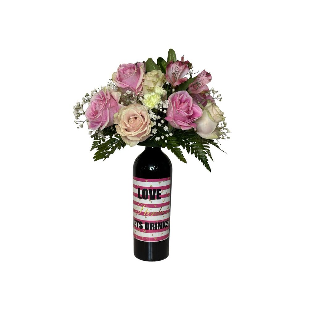 Wine and Flowers: Pink and cream blooms arranged in a wine bottle with a "LOVE AND DRINKS" striped label—an ideal romantic gift for Valentine’s Day or to pair with your favorite Cabernet.