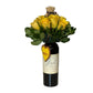The "Wine and Flowers" arrangement features a Cabernet wine bottle adorned with yellow roses, greenery, a small teddy bear, and a heart-shaped "SWEET" tag—making it a charming romantic gift or Valentine’s Day floral surprise.