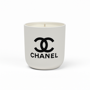 The White Ceramic Designer Candle showcases the black Chanel logo and brand name on a white ceramic container, making it an ideal designer piece for elegant interiors.