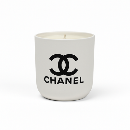 The White Ceramic Designer Candle showcases the black Chanel logo and brand name on a white ceramic container, making it an ideal designer piece for elegant interiors.