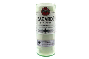 The Recycled White Rum Candle, crafted from a Bacardi Superior rum bottle and featuring its original label, adds unique style to your space as an eco-friendly, repurposed glass candle.