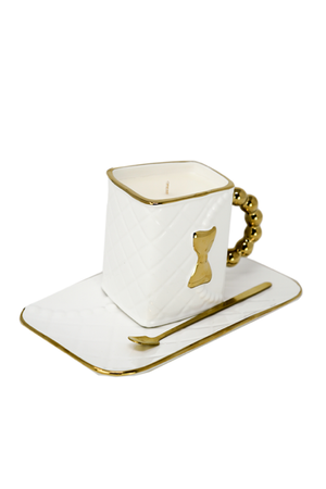 The 3D Design Handbag Shaped Ceramic Coffee Cups Set features a ceramic mug with gold handle and bow, matching rectangular plate, and gold-edged spoon—a stylish, practical decorative gift.