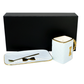 The 3D Design Handbag Shaped Ceramic Coffee Cups Set, featuring white ceramic cups with gold accents and a matching tray and spoon, is displayed in front of a sleek black rectangular box—an ideal practical decorative gift.