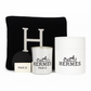 The Paris Designer Gift Set includes a black cushion with a white "H," a white Hermès candle, a Hermès box, and a "Paris" card, all elegantly arranged against a white background.