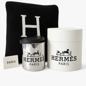 The Paris Designer Gift Set includes a Hermès candle in a silver holder, logo box, card, and "H" pillow—perfect for an elegant gift or pairing with a cozy cotton throw.