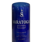 The Recycled Still Spring Water Bottle Candle transforms a blue glass "Saratoga Still Natural Spring Water, 28 fl oz" bottle into an eco-friendly soy candle, blending sustainability and unique design using a recycled water bottle.