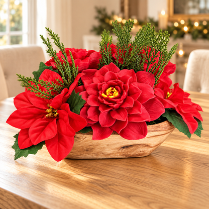 Poinsettia wax melt centerpiece with red wax blooms and greenery in a wooden bowl on a holiday dining table