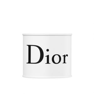 A white cylindrical container labeled "Dior" is centered on a plain white background, resembling the Designer White Paint Can Candle.