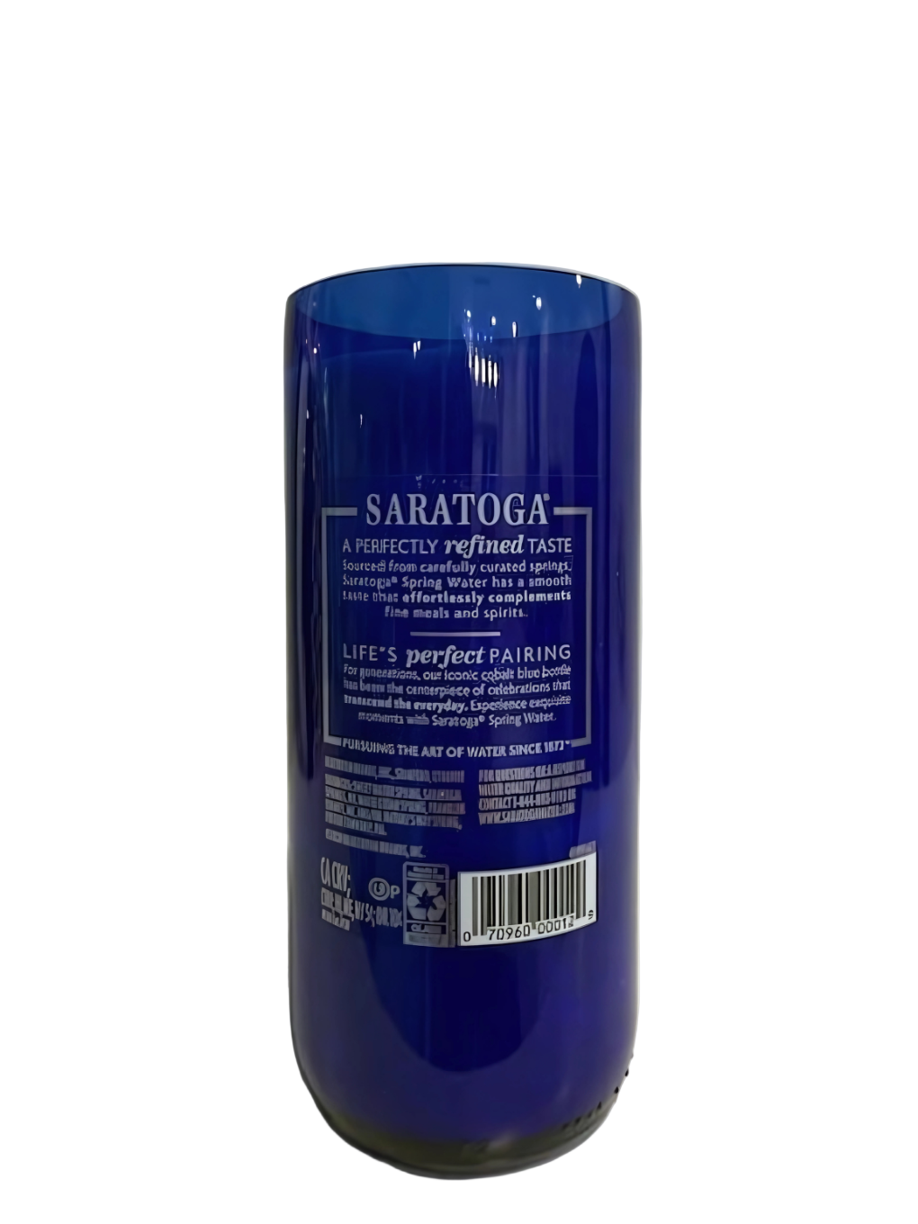 A blue Recycled Still Spring Water Bottle Candle stands upright, showcasing its branding and details on a white background—ideal for repurposing as a unique candle.