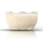 A clear, textured glass bowl filled with white liquid, identified as the Sugar Dish Motif Candle, is displayed against a white background with a faint reflection beneath.