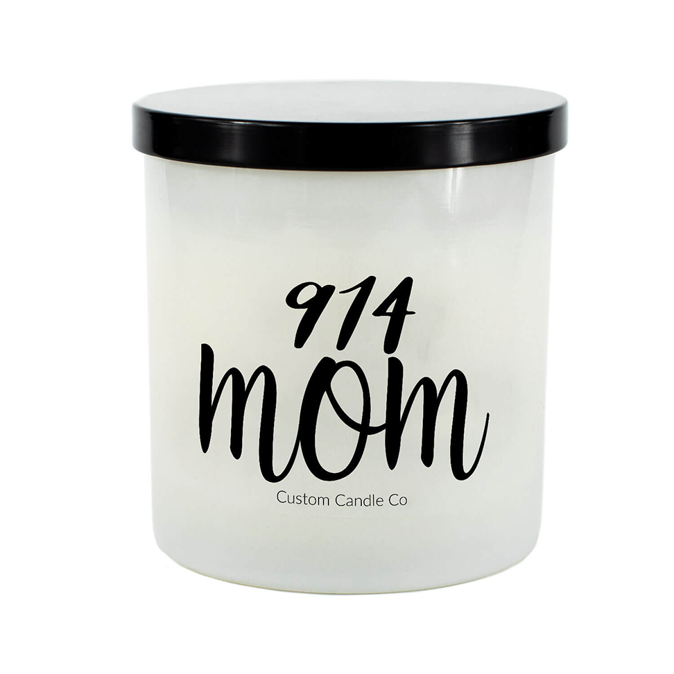 The 914 Mom White Glass Candle features a white jar with a black lid, labeled "914 mom" and "Custom Candle Co." Hand-poured soy wax makes it a perfect personalized accent for any room.
