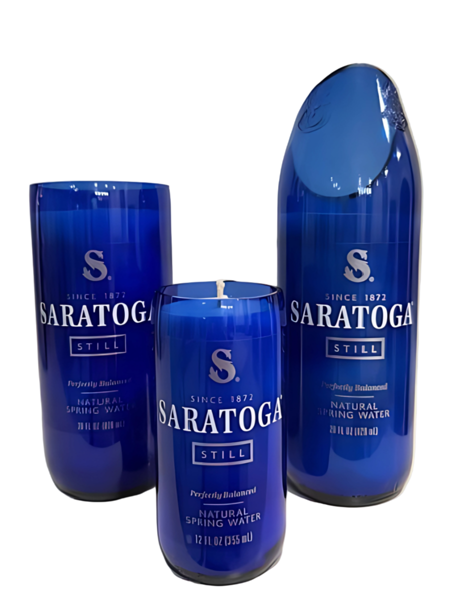 One "Recycled Still Spring Water Bottle Candle" and two blue glass containers shaped as drinking glasses, all originally labeled "Saratoga Still Natural Spring Water.