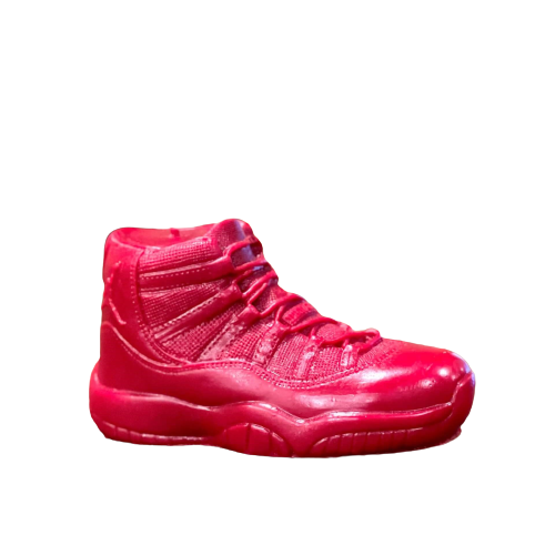 The AJ-11 Red Hightop Sneaker Candle – Large (On Backorder) is a hand-poured, all-natural wax candle shaped like a bright red athletic shoe, displayed in profile against a plain white background.