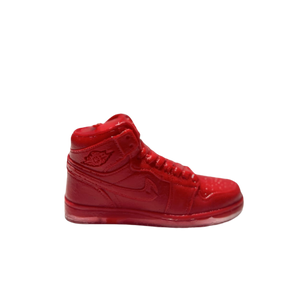 The AJ-1 Red Hightop Sneaker Candle – Large (On Backorder) is a hand-poured candle shaped like a bright red sneaker and scented with Black Ice, displayed against a plain white background.