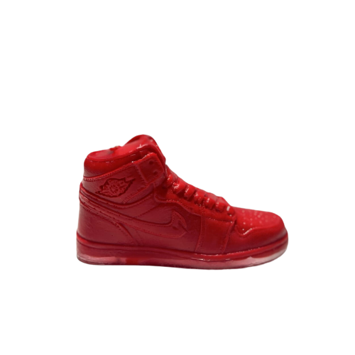 The AJ-1 Red Hightop Sneaker Candle – Small (On Backorder) is a hand-poured candle shaped like a red high-top sneaker, displayed against a plain white background to highlight its distinctive design.