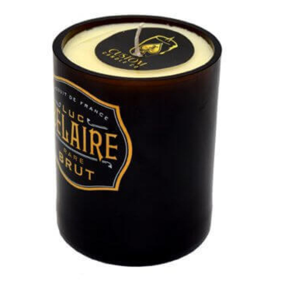 The Recycled Black Champagne Candle, labeled "LUC BELAIRE RARE BRUT," features a gold and black lid and is crafted from all-natural soy wax. It is displayed against a white background.