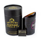 A black cylindrical box labeled "Custom Candle Co" with a Recycled Rare Rosé Champagne Candle in a cut bottle sits next to a branded matchbox.