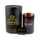 A black cylindrical "Custom Candle Co" box, a Recycled Rare Rosé Champagne Candle in a Luc Belaire Rosé bottle, and a small matchbox are displayed against a white background.