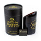The Recycled Black Champagne Candle features black cylindrical packaging with "Custom Candle Co." branding, an open all-natural soy candle in a recycled black champagne glass, and a small branded matchbox displayed in front.