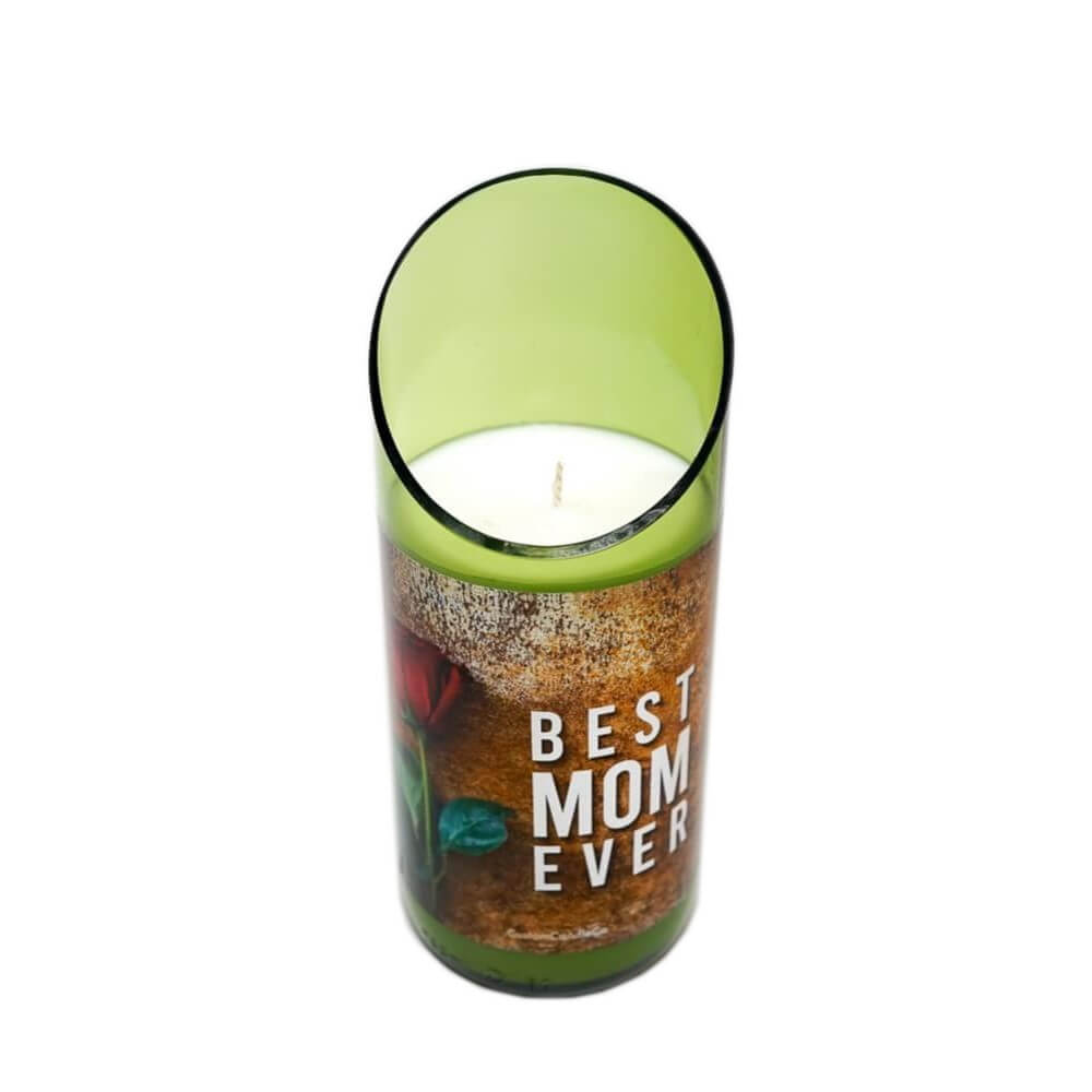 The “Best Mom Ever” Quote Candle is a green glass holder with an angled rim, featuring a white hand-poured soy candle and decorated with a red flower image.