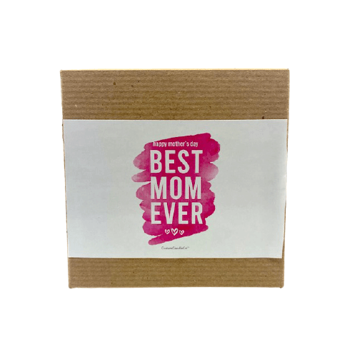 A brown box with a white label that says "Best Mom Ever" in bold pink letters—featuring the Best Mom Ever candle, lavender violet scented and made from soy wax. Perfect Mother’s Day gift. Product: Best Mom Ever, Pink Design with Brown Box.