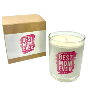 A white "Best Mom Ever" candle in a glass jar with a pink label and lavender violet scent sits beside a brown box, both labeled "Happy Mother's Day Best Mom Ever." Product Name: Best Mom Ever, Pink Design with Brown Box.