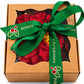 Poinsettia wax melt in a kraft gift box with a green Merry Christmas ribbon