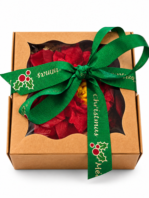 Poinsettia wax melt in a kraft gift box with a green Merry Christmas ribbon