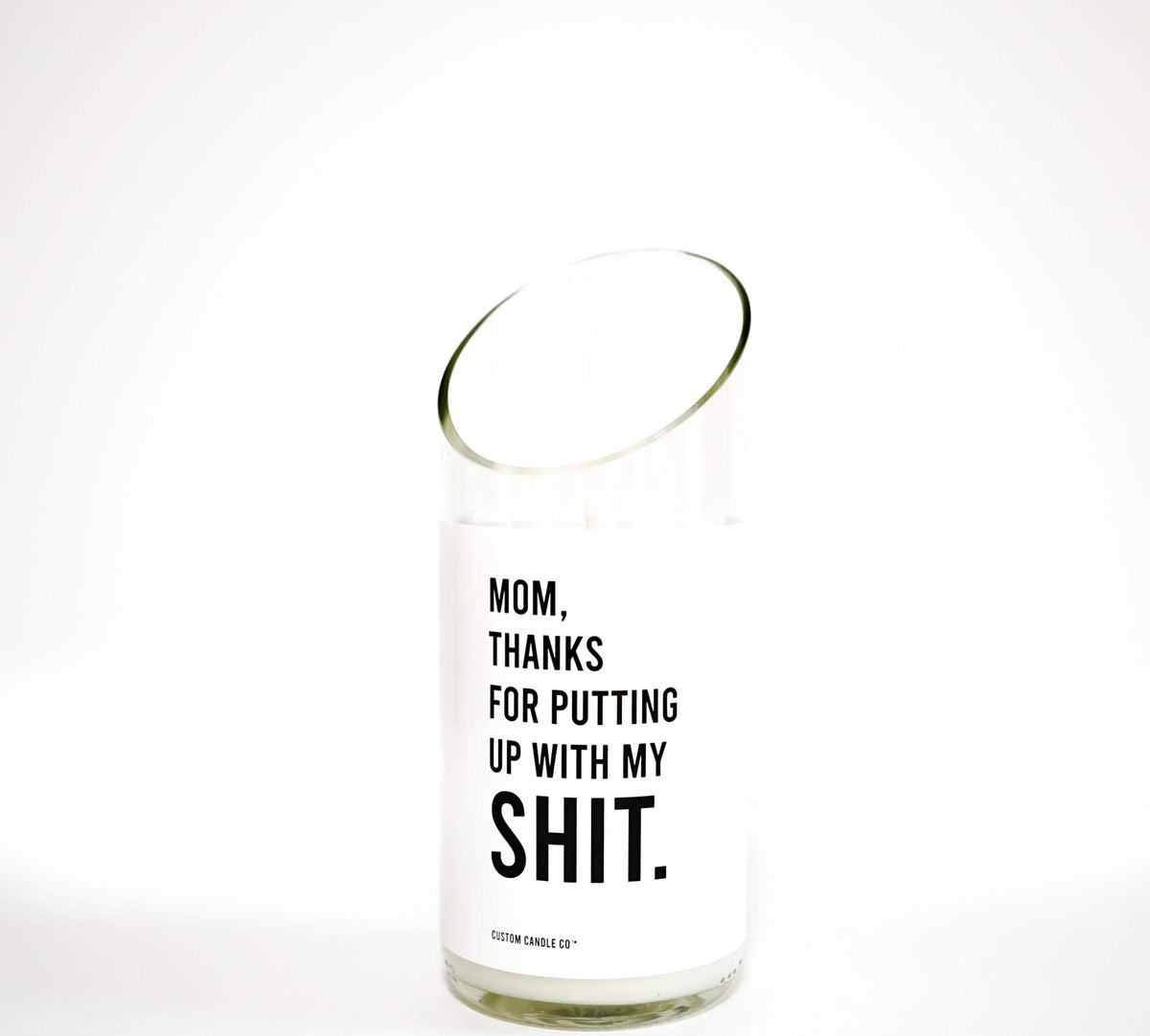 The Thanks for Puttin’ Up with My Shit soy candle, poured into a recycled wine bottle and featuring a white label, is displayed against a plain white background.