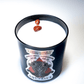 The Zodiac: Aquarius Candle is a black candle with white soy wax and two small brown stones on top—perfect for celebrating your star sign.