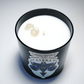 The Zodiac: Libra Candle is a black jar candle labeled "Libra," featuring three small gemstones set into the white soy wax.