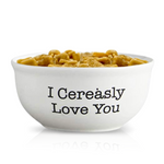 The Cereal Cinnamon Crunchy Candle comes in a reusable bowl featuring "I Cerealsly Love You" printed on the side.