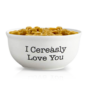 The Cereal Cinnamon Crunchy Candle comes in a reusable bowl featuring "I Cerealsly Love You" printed on the side.