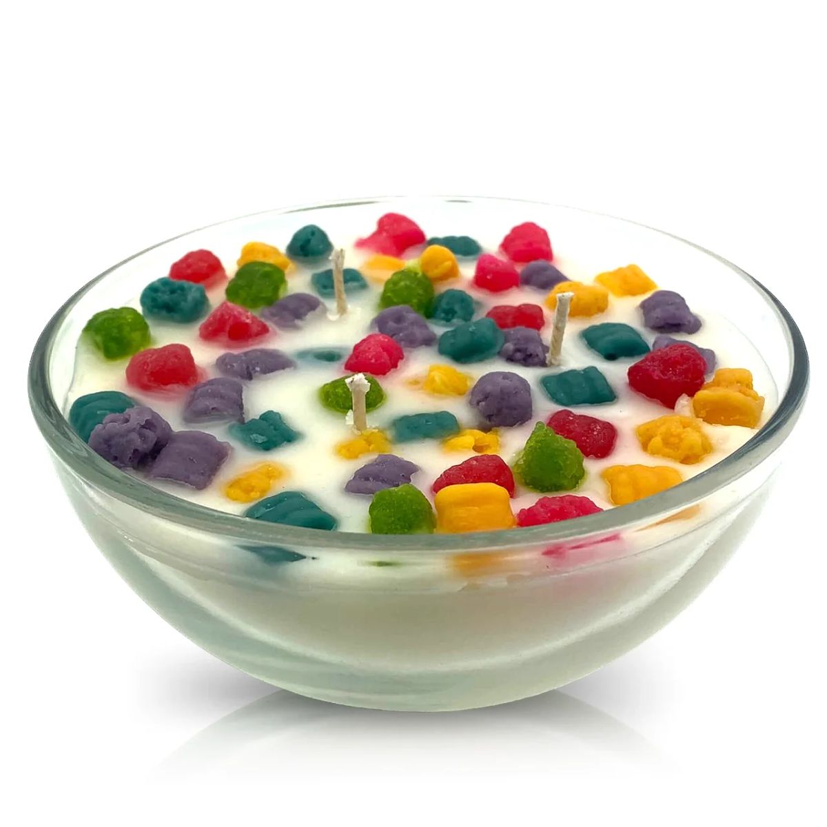 The Cereal Crunchy Berries Candle features a glass bowl with white wax, colorful cereal-like wax pieces, multiple wicks, and doubles as an eco-friendly, reusable cereal bowl after the candle is used.