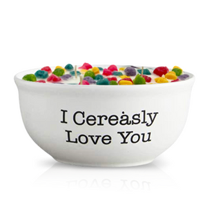 A Cereal Crunchy Berries Cereal Candle in a reusable white bowl with "I Cerealsy Love You" printed on it, designed to look like a bowl full of colorful cereal pieces and milk.