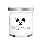 The Clear Tumbler Halloween Candle with Mouse Ears is a white candle in a glass jar with a silver lid, featuring a Mickey-shaped jack-o'-lantern and "Halloween" on the front.