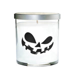 The Clear Tumblr Halloween Candle with Scary Pumpkin (Face #2) is a clear glass jar candle with a white soy wax, black jack-o'-lantern face design, and silver lid—perfect for adding festive Halloween decor to your space.