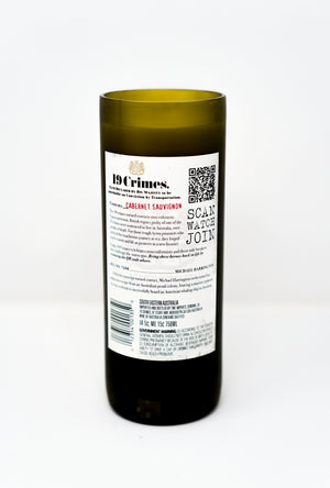 A Recycled Cabernet Sauvignon 2022 Wine Candle features a green bottle with a detailed label, QR code, and product info, set against a white background—ideal for wine lovers or pairing with natural décor.
