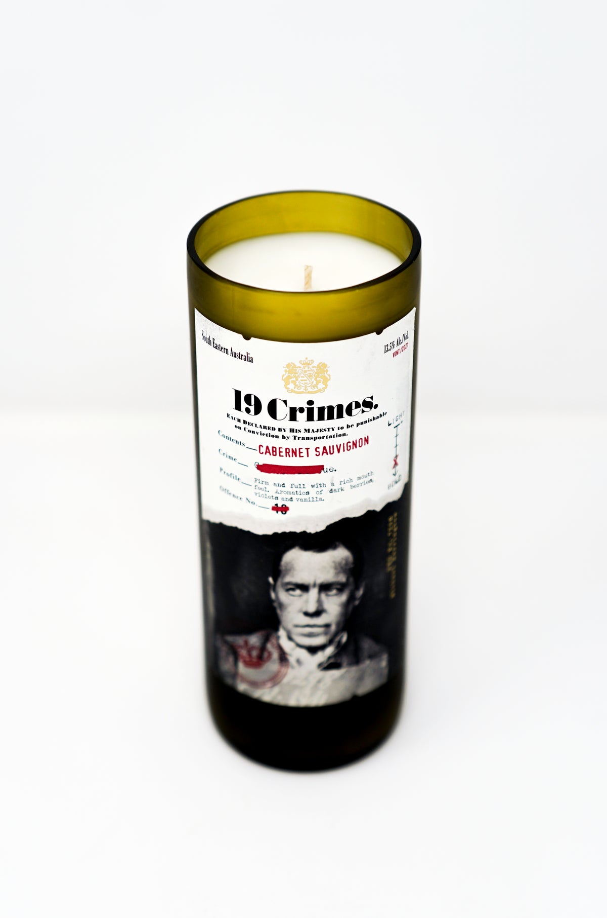 The Recycled Cabernet Sauvignon 2022 Wine Candle is made from a repurposed wine bottle and features a black-and-white portrait label on a white background.