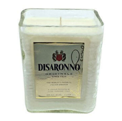 The Recycled Italian Liqueur Bottle Candle is a natural soy candle in a square glass container with a label inspired by Disaronno Originale liqueur.