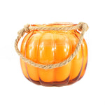 The Glass Pumpkin Lantern is an orange pumpkin-shaped glass jar with a rope handle, perfect as a Halloween lantern to add festive charm to any space. Shown against a white background.